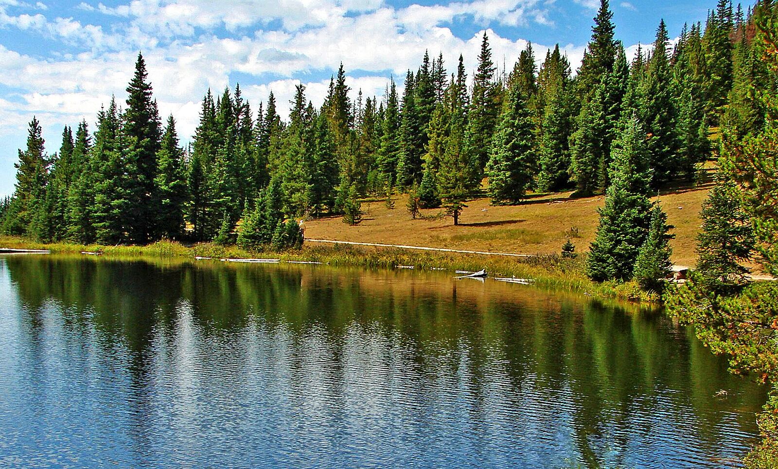 (1 in a multiple picture set) As you can see, when you visit Lake Irene in the national park, you don't have many other people to contend with. You can just sit and enjoy the view and the solitude. The reflections on the water were wonderful just then.