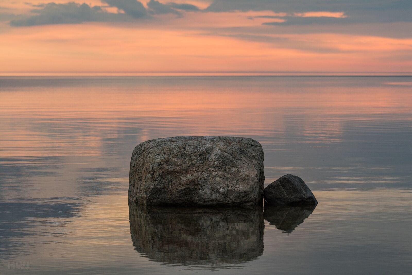 500px provided description: The sea at our coastal cottage is rarely very calm, so this was a big surprise for me. Simple and beautiful [#sky ,#sea ,#sunset ,#water ,#reflection ,#nature ,#beach ,#travel ,#evening ,#calm ,#outdoors ,#dusk ,#serenity ,#no person ,#Luvia]
