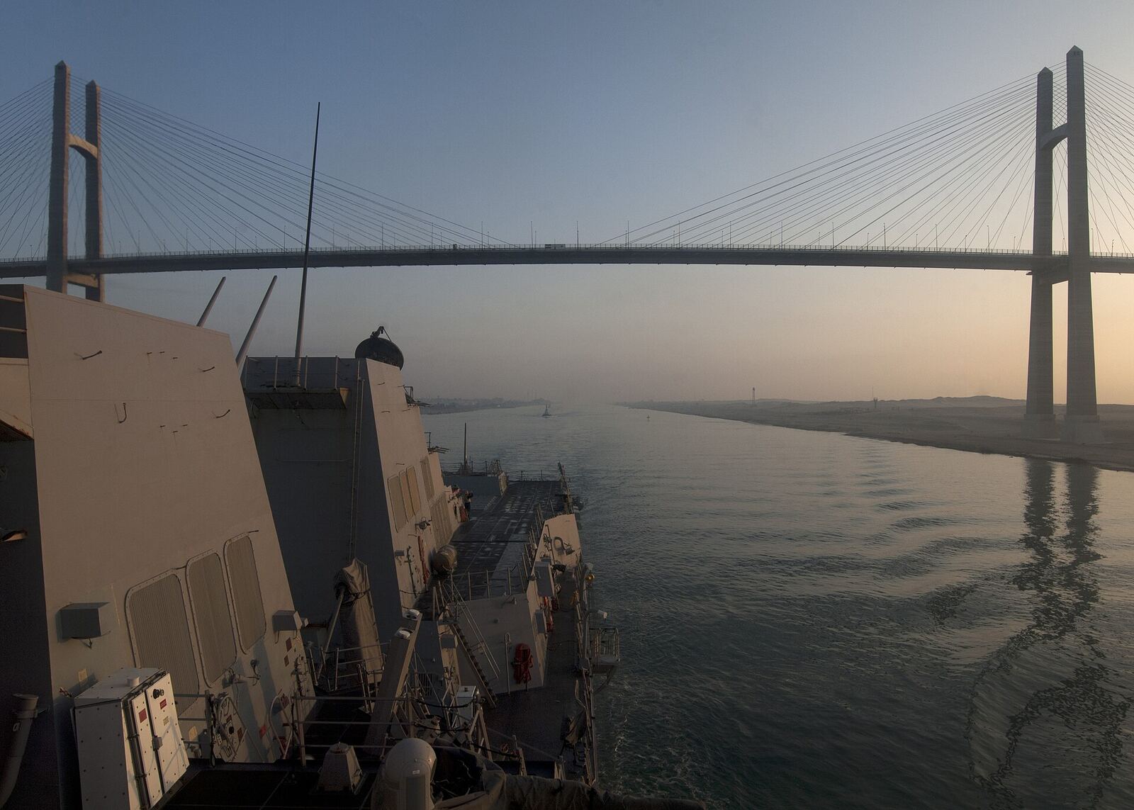 SUEZ CANAL (June 4, 2012) The guided-missile destroyer USS James E. Williams (DDG 95) passes underneath the Friendship Bridge during a Suez Canal transit. James E. Williams is deployed to the U.S. 5th Fleet area of responsibility conducting maritime security operations, theater security cooperation efforts and support missions as part of Operation Enduring Freedom. (U.S. Navy photo by Mass Communication Specialist 3rd Class Daniel J. Meshel/Released) 120604-N-NL401-117 Join the conversation www.facebook.com/USNavy www.twitter.com/USNavy navylive.dodlive.mil