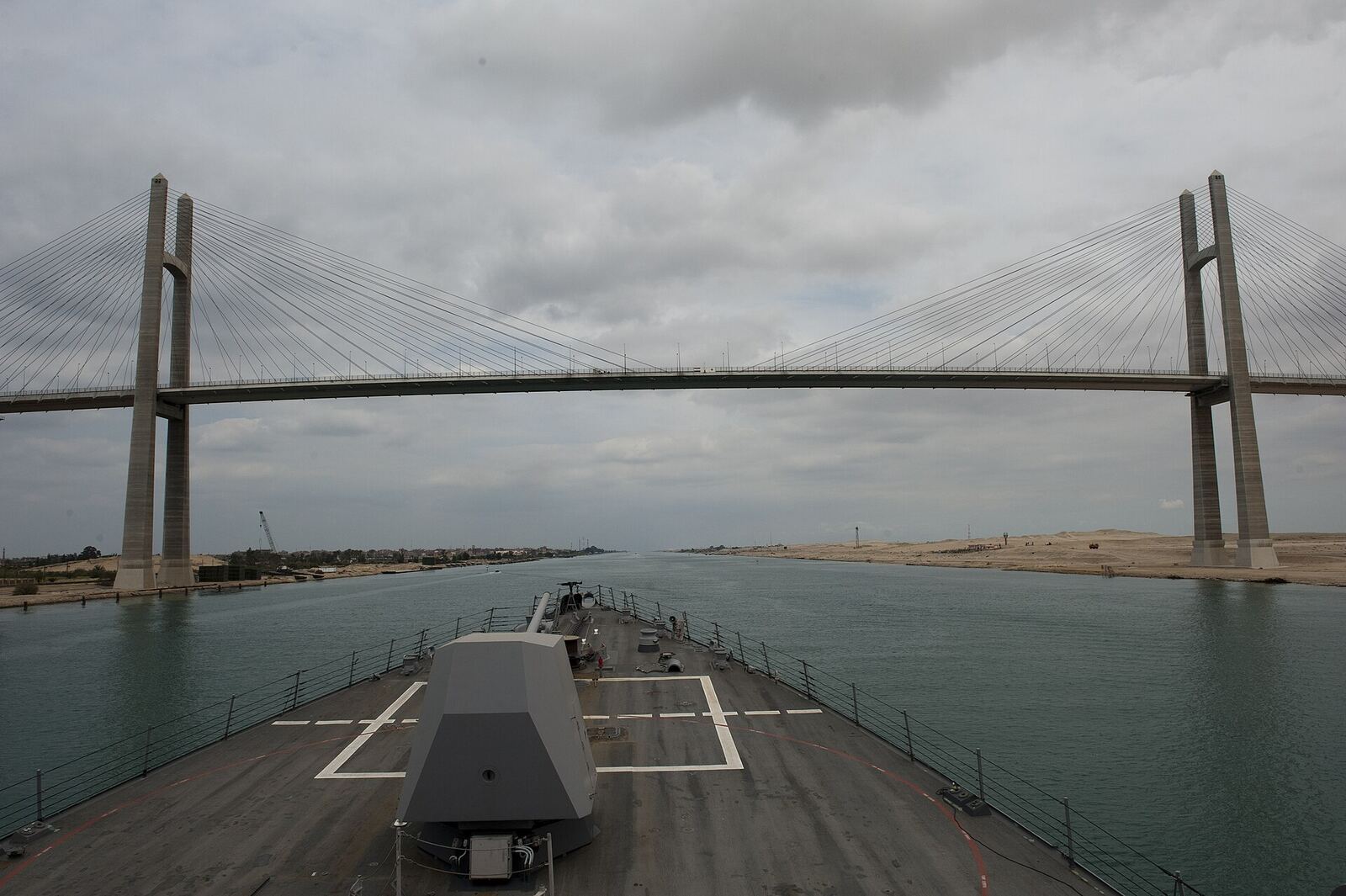 SUEZ CANAL (April 12, 2012) The guided-missile destroyer USS Nitze (DDG 94) passes under the Friendship Bridge during a transit of the Suez Canal. Nitze is deployed as part of Enterprise Carrier Strike Group to the U.S. 5th Fleet area of responsibility conducting maritime security operations, theater security cooperation efforts and support missions as part of Operation Enduring Freedom. (U.S. Navy photo by Mass Communication Specialist 3rd Class Jeff Atherton/Released) 120412-N-AP176-070 Join the conversation www.facebook.com/USNavy www.twitter.com/USNavy navylive.dodlive.mil