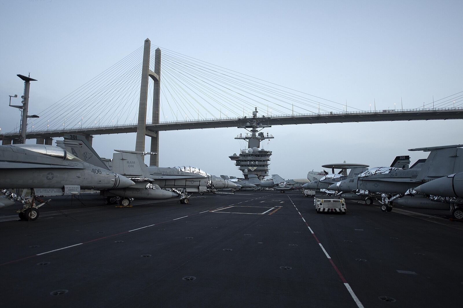 SUEZ CANAL (March 16, 2013) The aircraft carrier USS Dwight D. Eisenhower (CVN 69) passes under the Friendship Bridge in El Qantara, Egypt, while transiting the Suez Canal. Dwight D. Eisenhower is deployed to the U.S. 5th Fleet area of responsibility promoting maritime security operations, theater security cooperation efforts and support missions as part of Operation Enduring Freedom. (U.S. Navy photo by Mass Communication Specialist Seaman Andrew Schneider/Released) 130316-N-XQ474-021 Join the conversation www.facebook.com/USNavy www.twitter.com/USNavy navylive.dodlive.mil