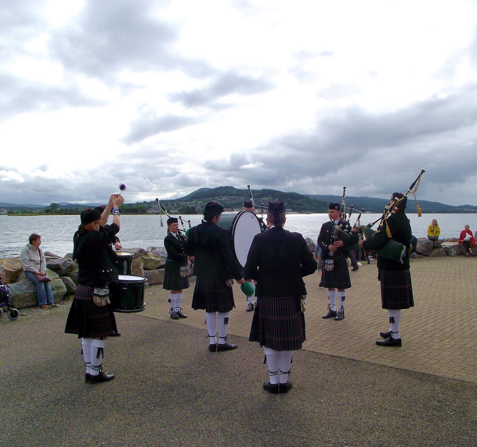 1,000 views on 15th October 2013 The Band playing outside the Lifeboat station with Craig Phadrig Hill, Inverness in the background (and Dunain Hill, with the radio masts on top, behind that). The village of Kessock (a.k.a. North Kessock) lies directly across the Beauly Firth from the City of Inverness. Until fairly recently, a ferry ran between the two, but since 1982 the imposing Kessock Bridge (carrying the A9 trunk road north from Inverness) has joined the two communities. en.wikipedia.org/wiki/Kessock_Bridge Kessock lies directly opposite the mouth of the River Ness, and Inverness Harbour and Marina, and the entrance to the Caledonian Canal is close by too. As a busy arm of the North Sea/Moray firth., the Beauly Firth is an important maritime route, both for commercial and leisure traffic. It took a long time to get a lifeboat based in the Inverness area but now that we do have the facility, locals are extremely proud - and supportive - of the Kessock lifeboat and its brave crew. The Lifeboat station is located at Craigton Point, directly under the north end of the Kessock Bridge. Several Band members have family or friends in the crew, hence we were delighted to be able to support and assist at the RNLI Kessock Station open day today (24th August 2013) by providing a mini-band to entertain the visitors. Kessock is one of Scotland’s youngest lifeboat stations, operating an inshore B class Atlantic 75 lifeboat – “The Moray Dolphin”. For over 10 years the lifeboat crews have launched the lifeboats, not only to save lives at sea but also to save lives inland during flooding. rnli.org/findmynearest/station/Pages/Kessock-Lifeboat-Sta...