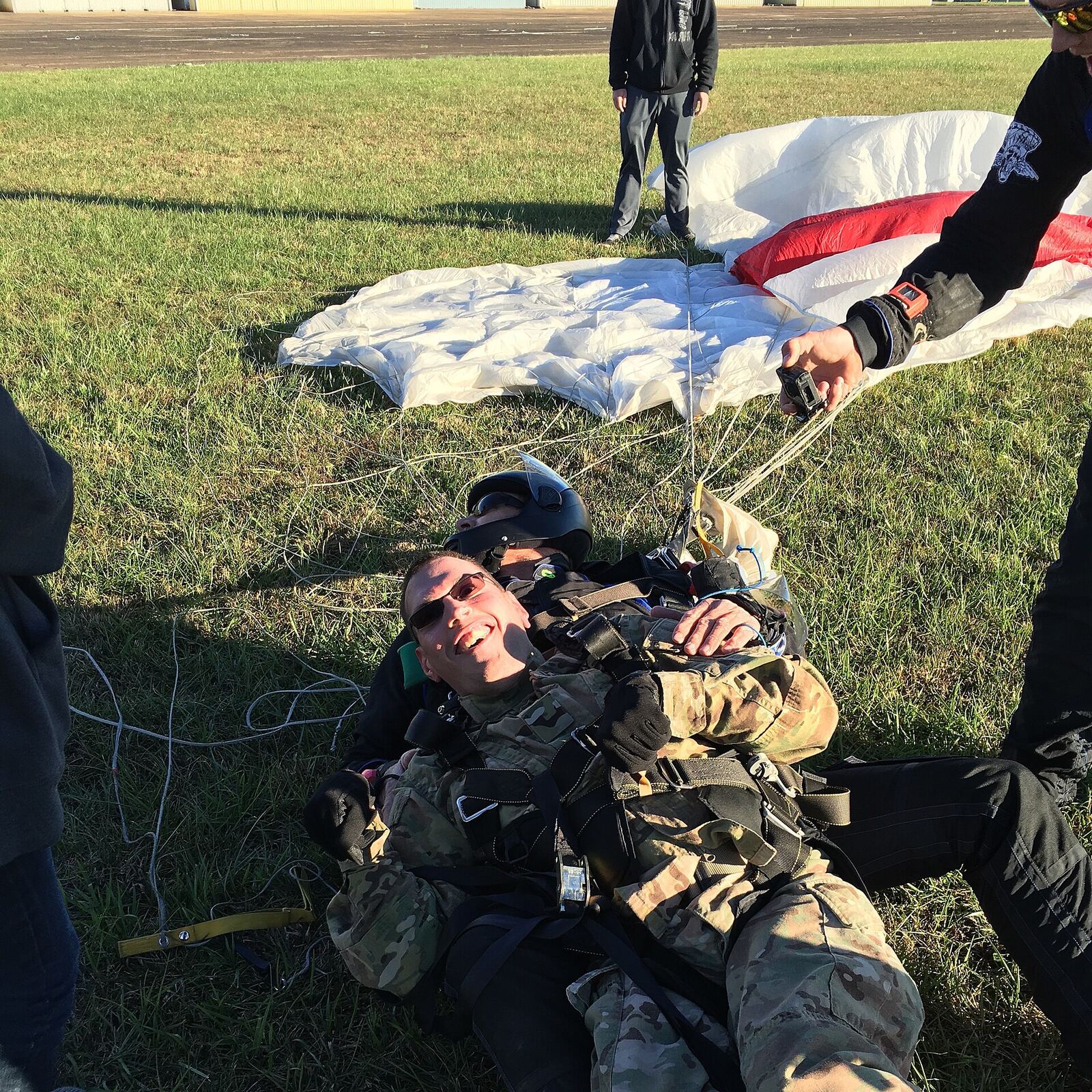 A campus-wide campaign has aimed for the clouds to help a student achieve a life-long dream. Shawn Sattazahn, 34-year-old Russellville native and cadet in WKU ROTC, has wanted to go skydiving ever since he was a little kid. Thanks to a recent campaign to put him in the sky, Sattazahn’s dream will soon become a reality. The campaign Get Shawn in the Sky was created on Oct. 16 as a Facebook page, Twitter hashtag and GoFundMe campaign. The goal of the fundraiser was to raise $875 to cover skydiving costs and a GoPro Camera for Sattazahn to wear during his jump. At the time of publication, the campaign has exceeded its goal and raised $885. However, Sattazahn isn’t just seeking the exhilarating thrill of the jump when he goes skydiving. He said he’s also looking to fulfill a military requirement. “I’m not just doing it to be doing it; I’m getting the training for my military career later on,” he said. He said to be officially certified as a Jumpmaster, you have to complete five to 28 jumps, but the ROTC program has made concession for him to get his jump wings after one solitary jump. He’s also looking forward to learning how to skydive properly so he can do it again if he wants to. “It’s … unheard-of for people with quadriplegic cerebral palsy to actually want to do military service,” Sattazahn said. “I’ve got the mind for it, just not the body.” Sattazahn was born with quadriplegic cerebral palsy. He said certain people with the condition are sometimes unable to talk and perform other functions by themselves such as eating. He said he was “very blessed” for the skills he possesses. Sattazahn said his condition has created obstacles for him in the past. He recalled one time when he wanted to play football but had to sit on the sidelines. Although he said these instances were very disappointing sometimes, he doesn’t allow these disappointments to bring him down. “You have to raise above your obstacles, and don’t let anything prevent you from achieving your goal,” Sattazahn said. The Get Shawn in the Sky campaign was started by Bardstown senior Tim LeMastus, who is Sattazahn’s neighbor. LeMastus said he originally wanted to take Sattazahn kayaking, but his lack of balance would prevent him from doing this. Skydiving became the next choice. “I don’t really have a reason why I did it, but I go down and knock on his door and I’m like, ‘Hey, you ever wanted to go skydiving?’” LeMastus said. “I’ve never seen somebody that happy. I asked him, and he just lit up.” Sattazahn said LeMastus created the campaign on a whim, and the campaign’s overall success and support has completely shocked him. “It just made me be in total shock that somebody would actually take an interest in who I was as a person and [want] to fulfill a dream of mine,” Sattazahn said. LeMastus set up a table for the campaign Tuesday in Downing Student Union, where he sold koozies for $2 and accepted donations from people who passed by. “I’m sorry — I only have change,” one student said while donating money for the campaign. LeMastus said he has met some amazing people during the time he set up his table. He recalled a man with holes in his shirt who took out change and put it in the bucket. “I said, ‘Hey, want your koozie?’ and he said, ‘No this is awesome,’” LeMastus said. Sattazahn expressed confusion as to why people were being so supportive and questioned LeMastus about his incentive to promote the campaign, but LeMastus said people can do nice things for others and not need a reason. “Hey, we can all get in our car and go skydiving; he can’t,” LeMastus said. Sattazahn said he was worried his health would be an obstacle and that he wouldn’t obtain medical clearance for his jump. Fortunately, he said, his doctor has cleared him for it, and Sattazahn will be obtaining a written letter of consent within the next few days. He said the support from family and friends has been overwhelming. “I guess my faith and my family and even my friends are the ones that are saying, ‘You can do this. You can do whatever you please; don’t let anything stop you,’” Sattazahn said. “That’s what I would tell my fellow students: ‘Don’t let anything stop you.’” LeMastus said Sattazahn will dive through the skies on Nov. 8.